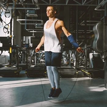 A person doing a workout finisher in the gym