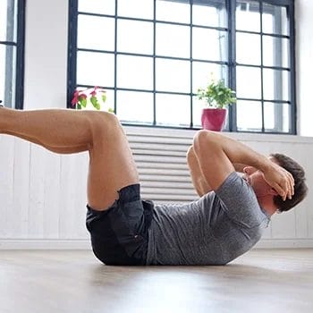 Reverse crunches at home gym