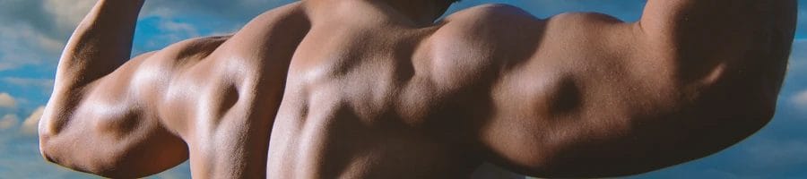 A person flexing his tricep muscles