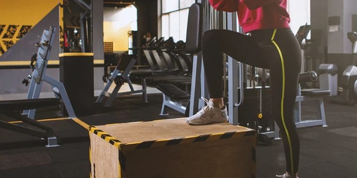 A person doing step exercises in the gym