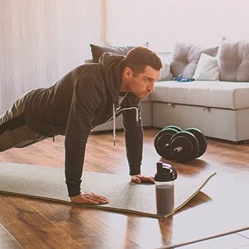 A person working out at a home gym