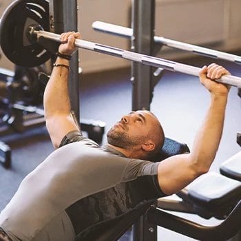 A person working out his upper body with bench presses
