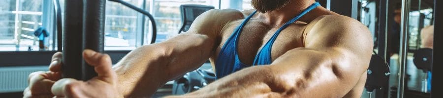 A person working out his triceps in the gym