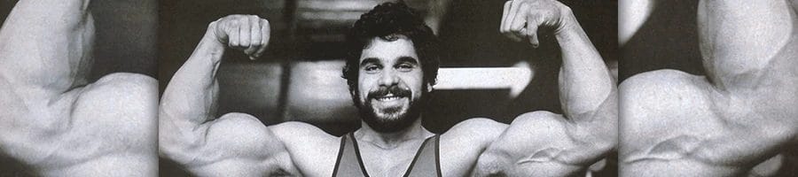 Lou Ferrigno working out in the gym flexing his muscles