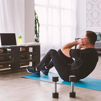 A man working out in a small home gym