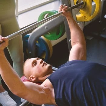 A person doing best upper body compound exercises