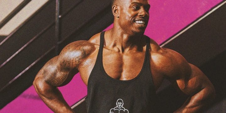Simeon Panda flexing his arm muscles gained from workout
