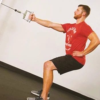 A person doing a single arm standing cable row workout